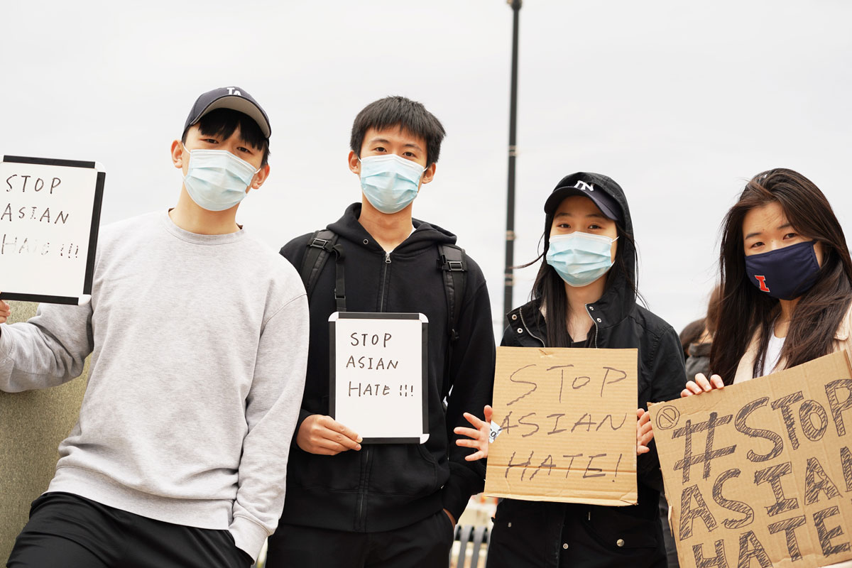 A group of University of Illinois students hold signs that say “Stop Asian Hate” at a rally in downtown Champaign in March 2021. Students have been going to the University’s Asian American Cultural Center about Asian racism since long before the pandemic, center director David Chih said.