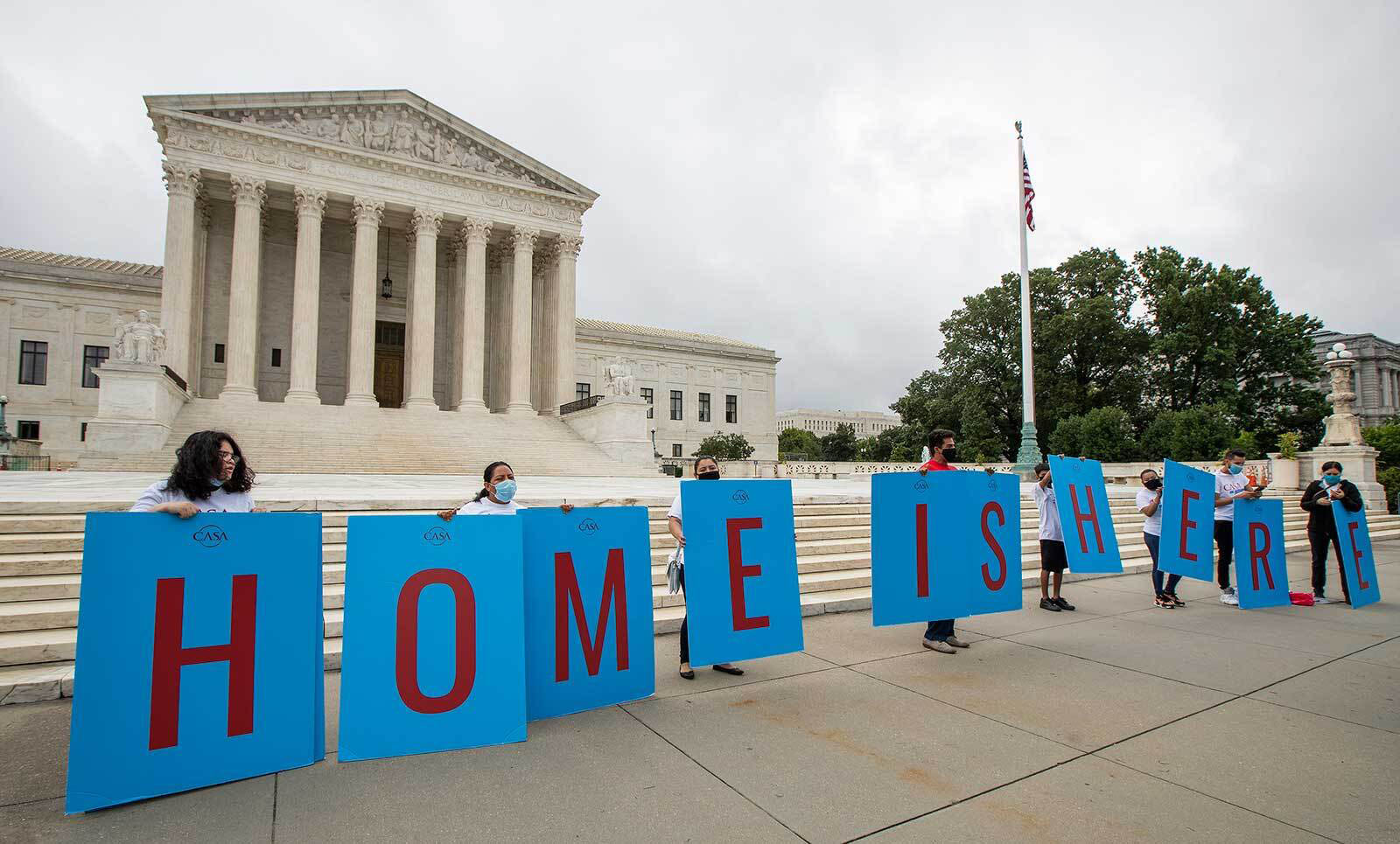 In this June 18, 2020 file photo, Deferred Action for Childhood Arrivals (DACA) students gather in front of the Supreme Court in Washington. The vast majority do not support a border opening or an amnesty for the nearly 11 million immigrants living illegally in the United States, but they do support changes in immigration laws that have not been updated for decades.